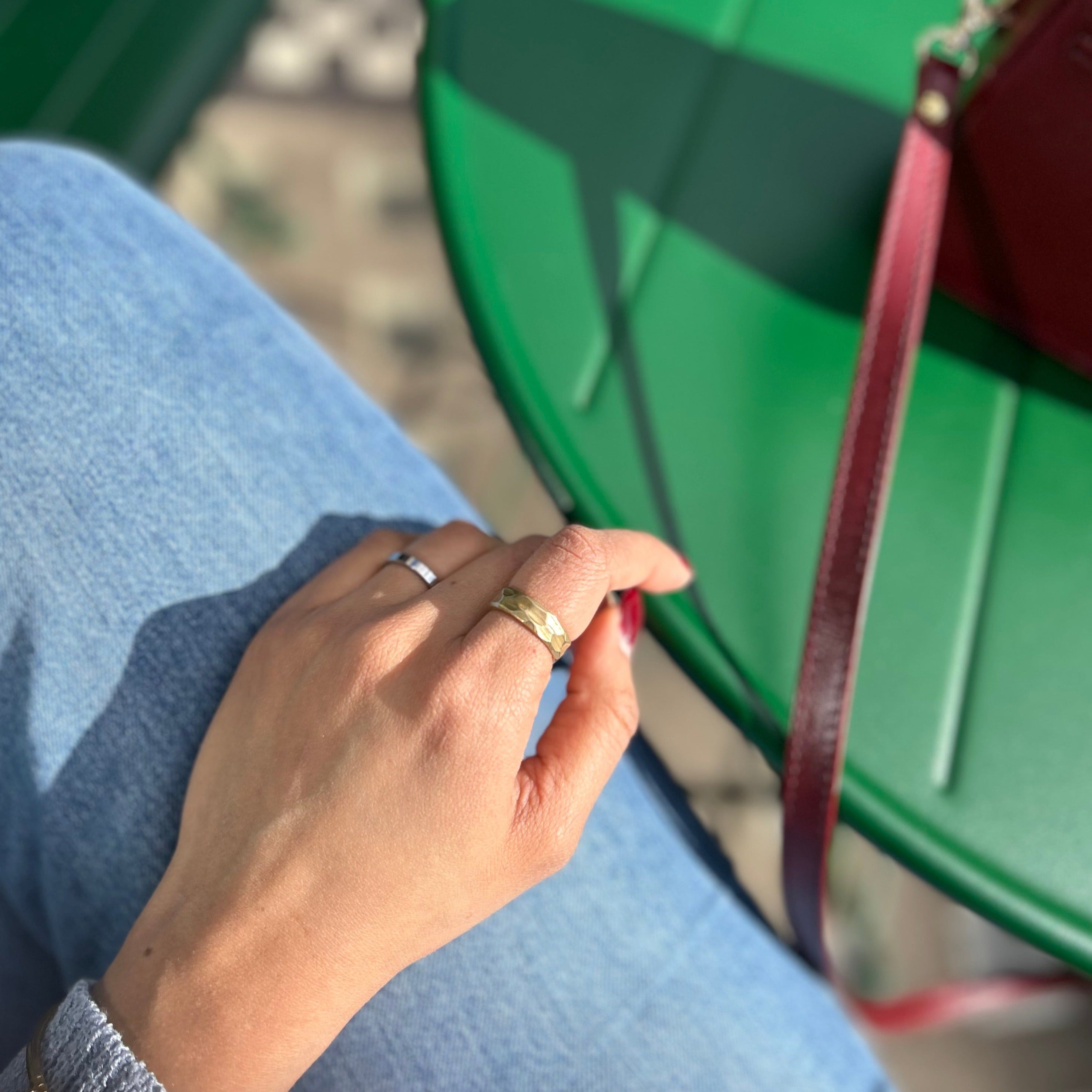 Hammered brass ring in sun