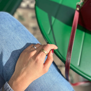 Hammered brass ring in sun