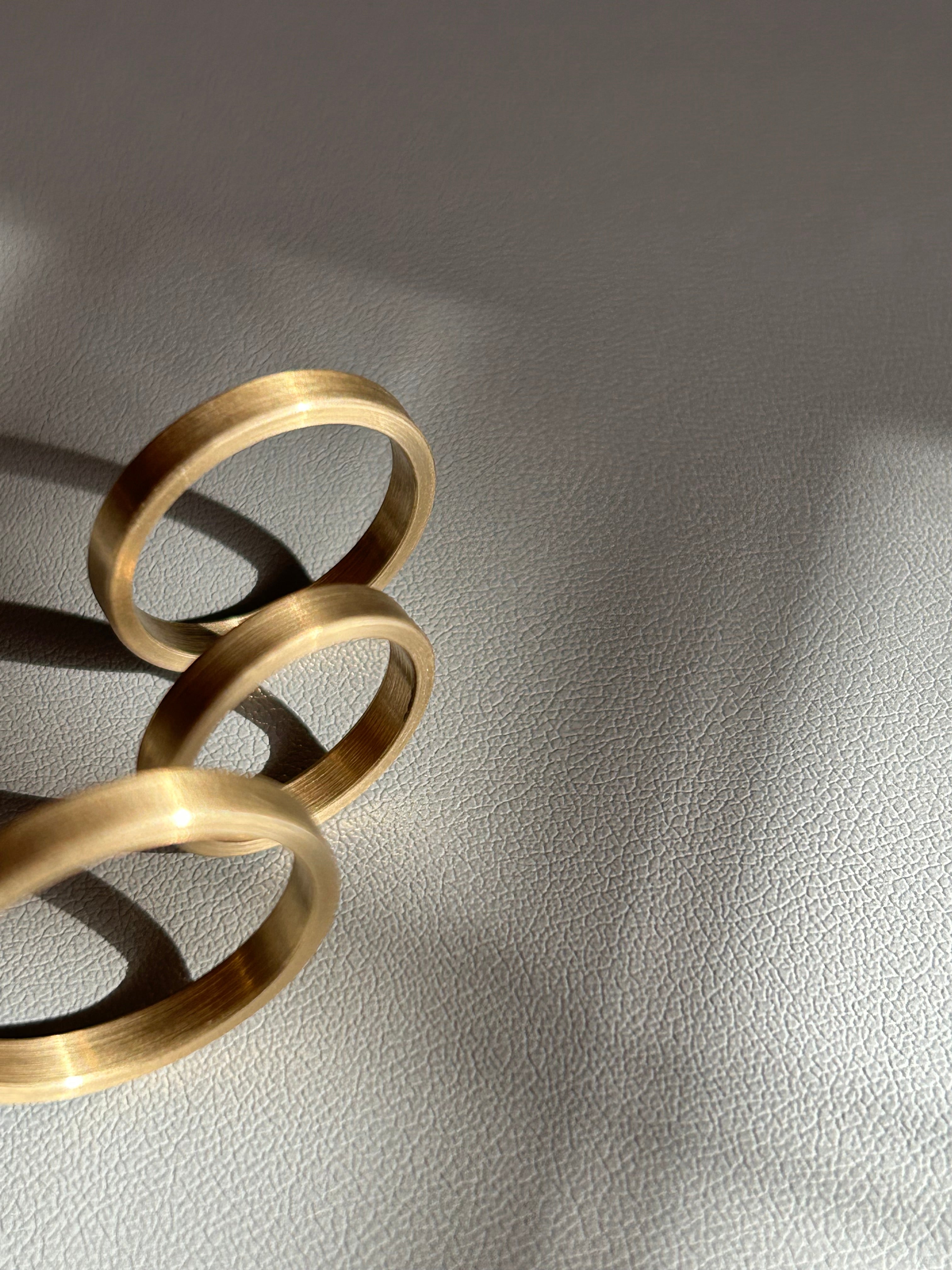 Three brass rings