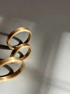 Three brass rings