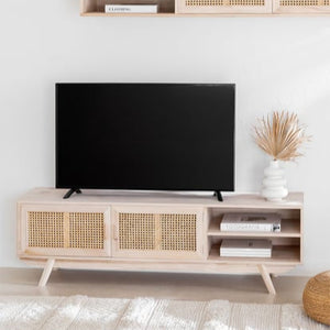 A beige Abbey Cane Cabinet with cane panel inserts, featuring multiple compartments and an open shelf, set against a lifestyle background.